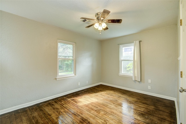 spare room featuring ceiling fan and hardwood / wood-style floors