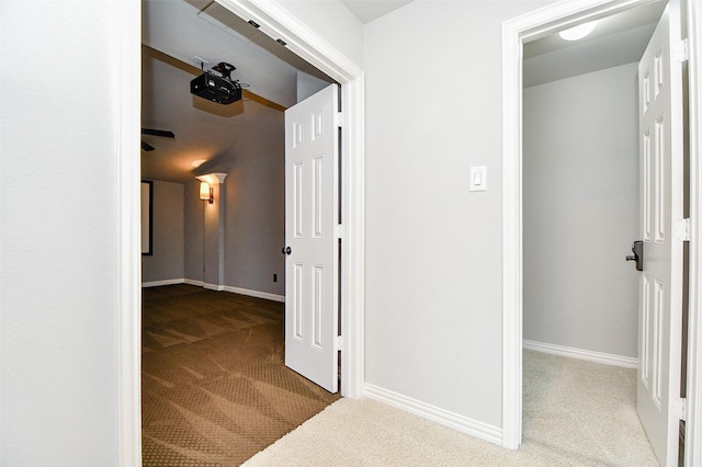 corridor with carpet flooring