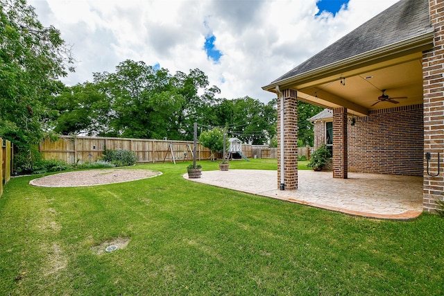 view of yard featuring a patio and ceiling fan