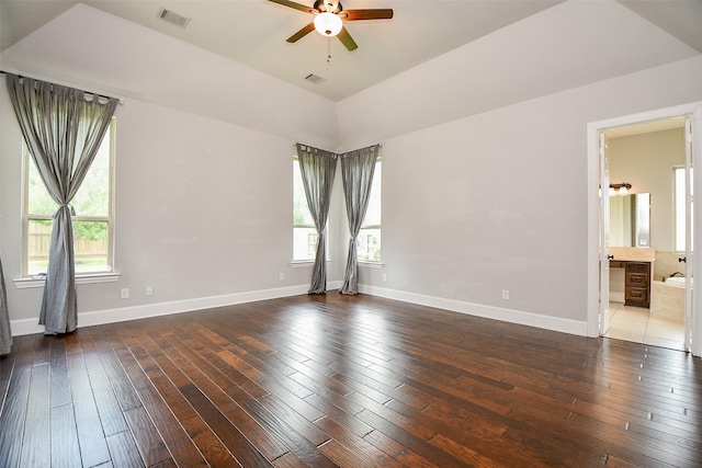 spare room featuring dark hardwood / wood-style flooring and ceiling fan