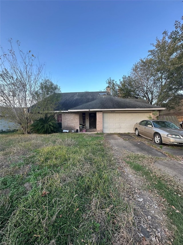 ranch-style house featuring a garage