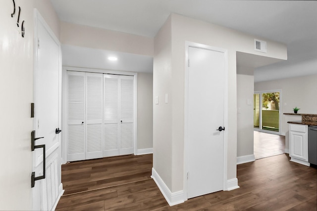 hallway featuring dark hardwood / wood-style flooring