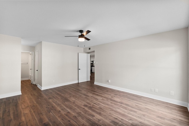 unfurnished room featuring dark hardwood / wood-style floors and ceiling fan