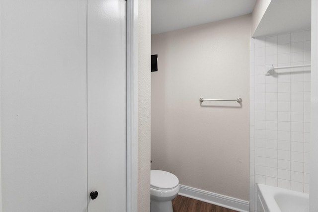 bathroom with hardwood / wood-style floors and toilet