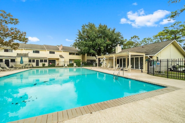 view of swimming pool with a patio area