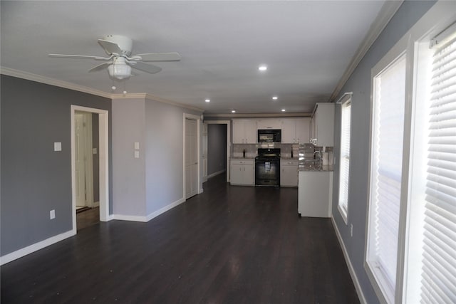 kitchen with tasteful backsplash, dark hardwood / wood-style flooring, white cabinets, black appliances, and ornamental molding