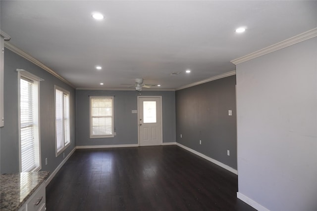 foyer entrance featuring dark hardwood / wood-style floors, ceiling fan, and ornamental molding