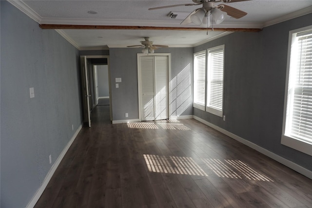 spare room with ceiling fan, a healthy amount of sunlight, dark hardwood / wood-style floors, and ornamental molding