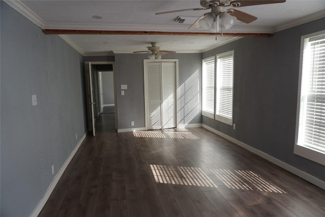 spare room featuring ornamental molding, a wealth of natural light, dark wood-type flooring, and ceiling fan