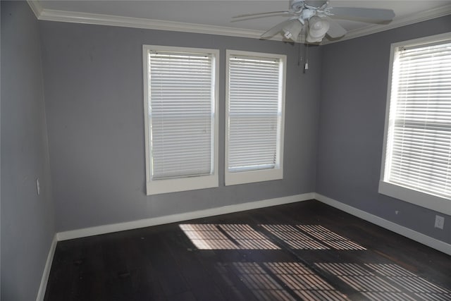 spare room featuring dark hardwood / wood-style floors, ceiling fan, and ornamental molding