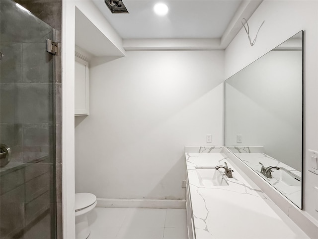 bathroom with tile patterned floors, vanity, toilet, and walk in shower