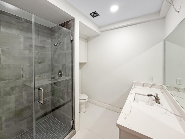 bathroom featuring tile patterned flooring, vanity, toilet, and an enclosed shower