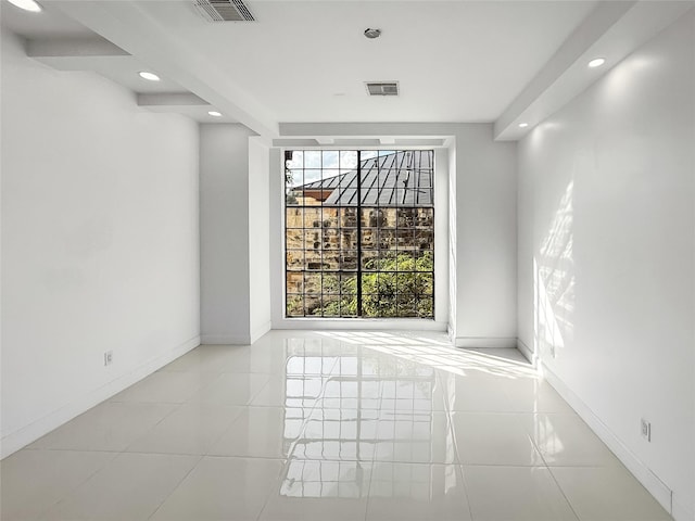 unfurnished room featuring light tile patterned floors