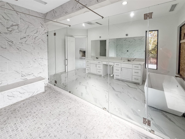 bathroom with vanity and independent shower and bath