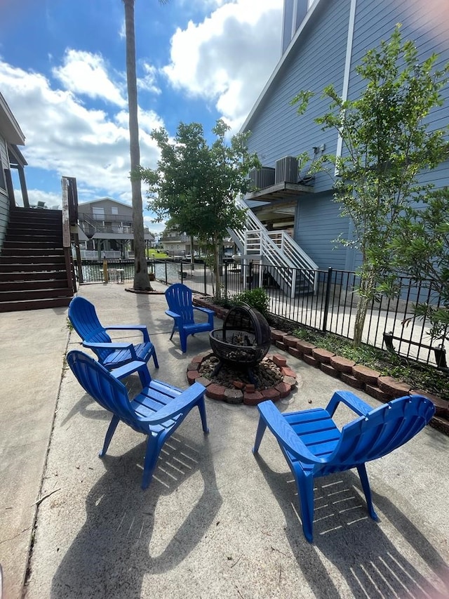 view of patio featuring an outdoor fire pit