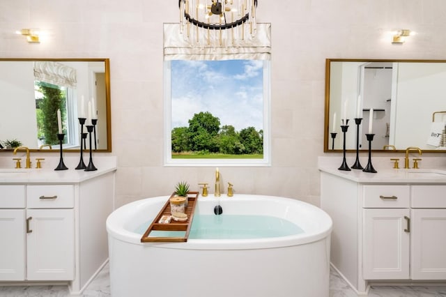 bathroom featuring tile walls, vanity, and a bathtub