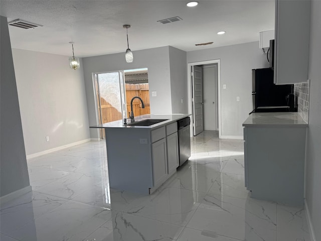 kitchen featuring stainless steel dishwasher, a kitchen island with sink, sink, hanging light fixtures, and fridge