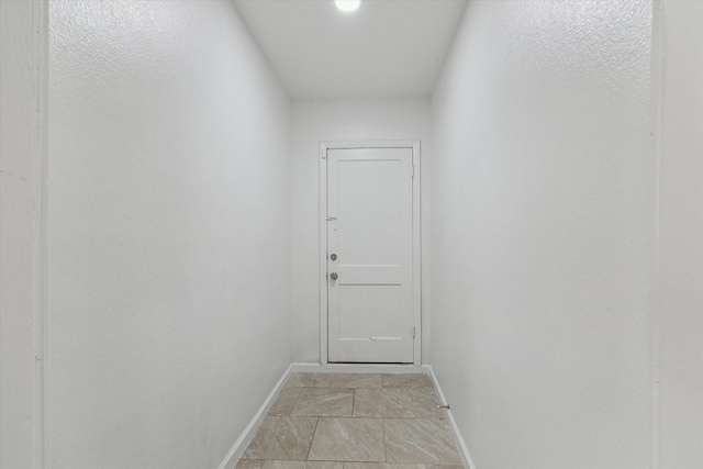 entryway with light tile patterned floors