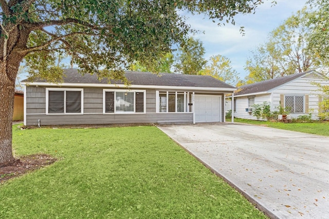 ranch-style house featuring a front yard and a garage