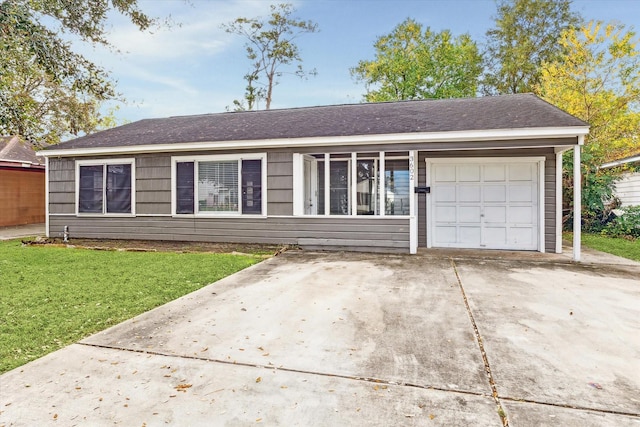 single story home featuring a front lawn and a garage