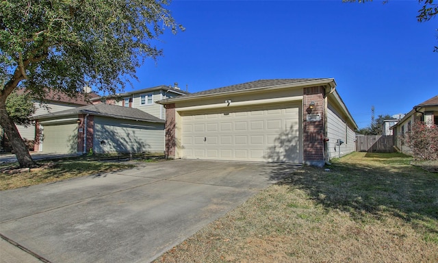 view of home's exterior featuring a garage and a yard