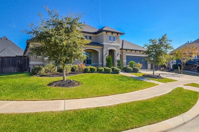 view of front facade featuring a front lawn and a garage