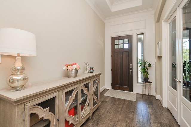 entryway featuring dark hardwood / wood-style flooring and ornamental molding