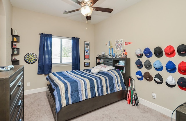 bedroom with ceiling fan and light colored carpet