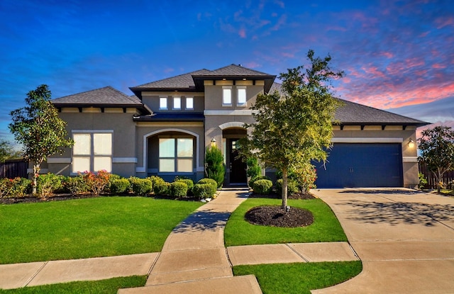 prairie-style home featuring a lawn