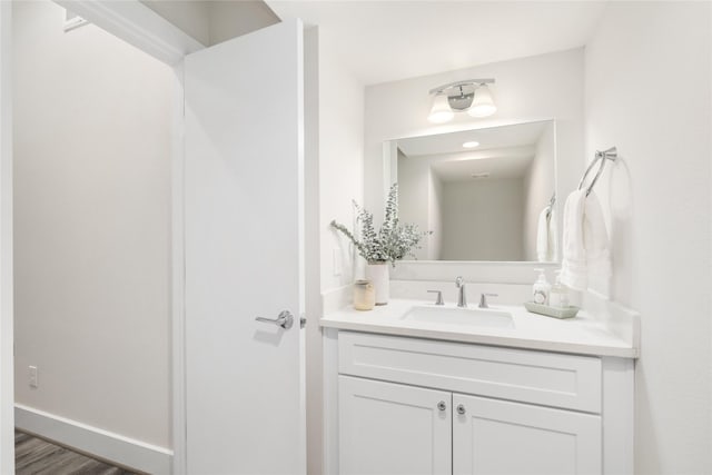 bathroom featuring hardwood / wood-style floors and vanity