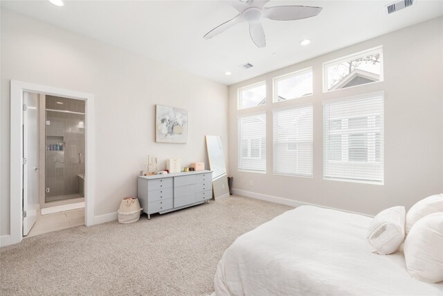 carpeted bedroom featuring connected bathroom and ceiling fan