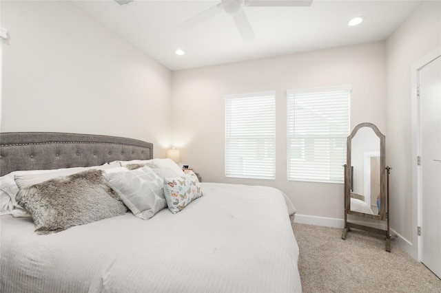 bedroom featuring ceiling fan and light carpet