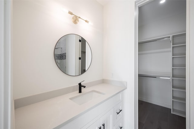 bathroom featuring hardwood / wood-style floors and vanity