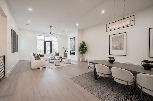 dining room featuring light hardwood / wood-style floors and ceiling fan