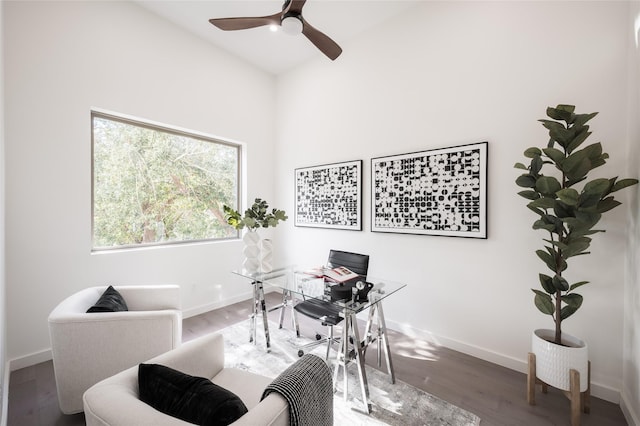 office space with ceiling fan, hardwood / wood-style floors, and high vaulted ceiling