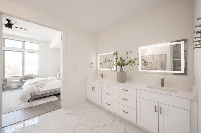 bathroom with ceiling fan and vanity