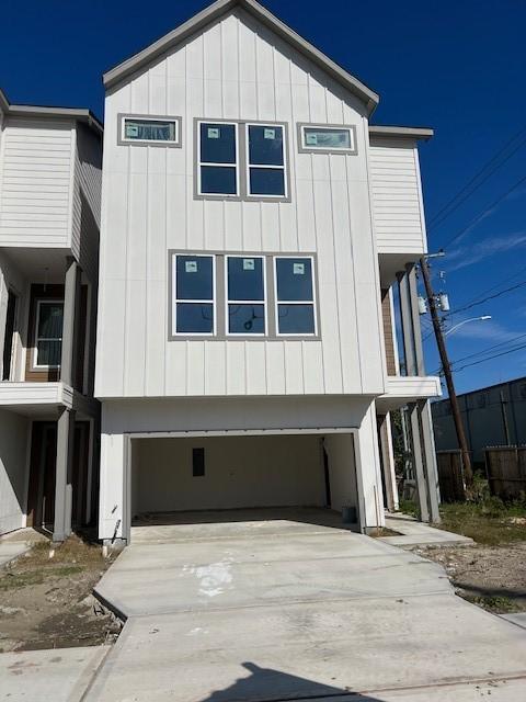 view of side of property with a garage