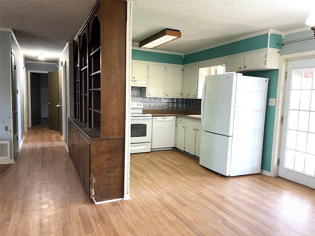 kitchen with light hardwood / wood-style floors, crown molding, white appliances, and a textured ceiling