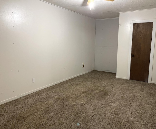 unfurnished room with ceiling fan, carpet floors, and a textured ceiling