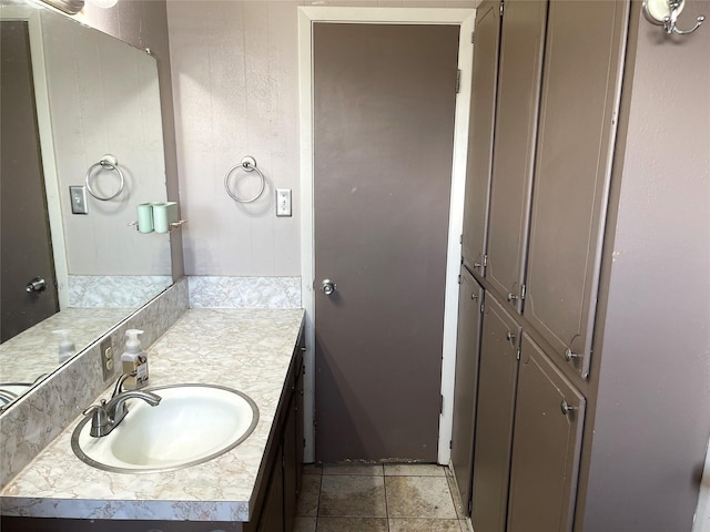 bathroom with tile patterned floors and vanity