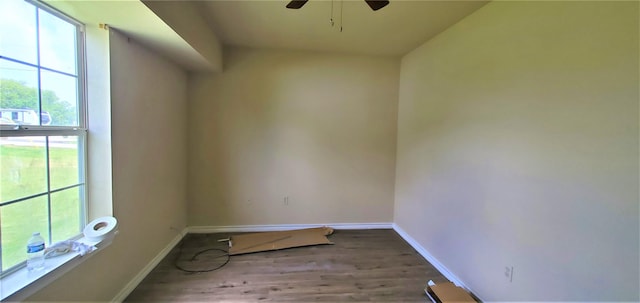 unfurnished room with ceiling fan and wood-type flooring