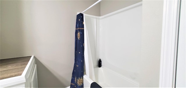 bathroom featuring shower / tub combo with curtain