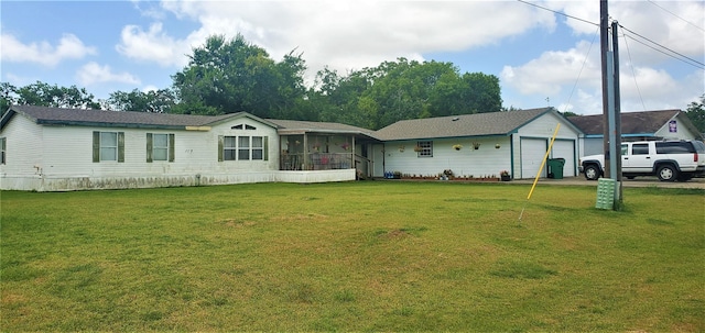 view of front facade featuring a sunroom and a front yard