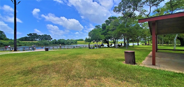 view of property's community with a lawn