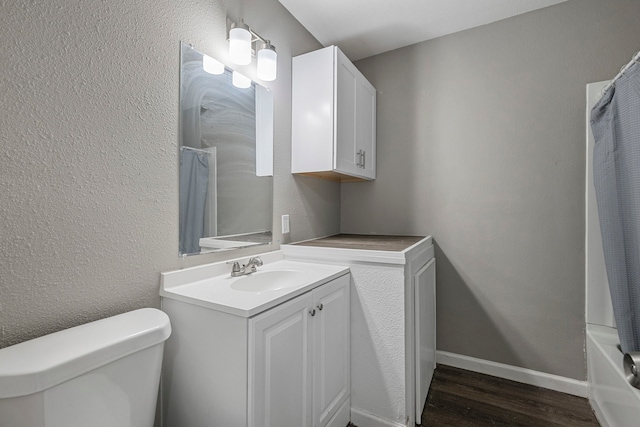 full bathroom with wood-type flooring, vanity, toilet, and shower / bathtub combination with curtain