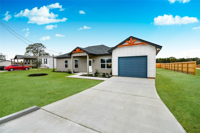 view of front of house with a front yard and a garage