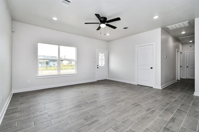 empty room featuring ceiling fan and light hardwood / wood-style flooring