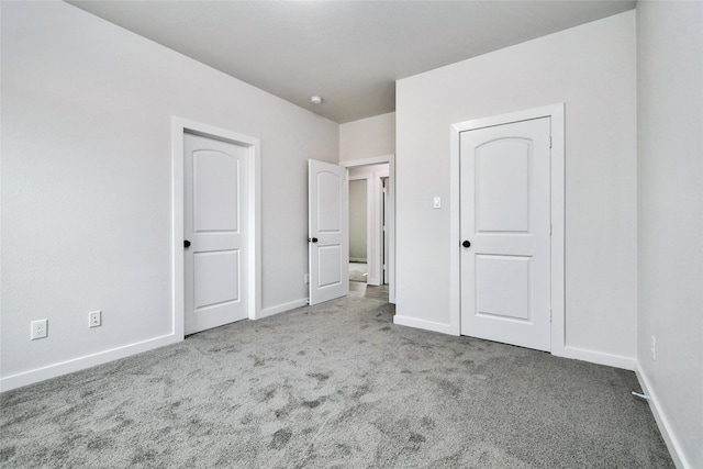 unfurnished bedroom featuring carpet