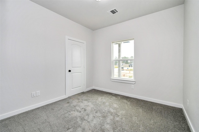 spare room featuring carpet flooring