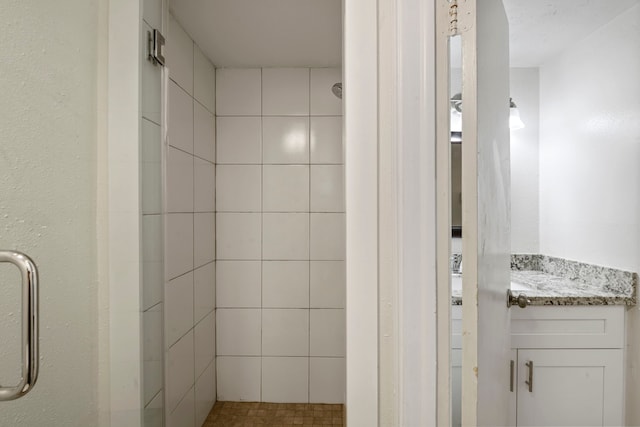 bathroom featuring vanity and walk in shower